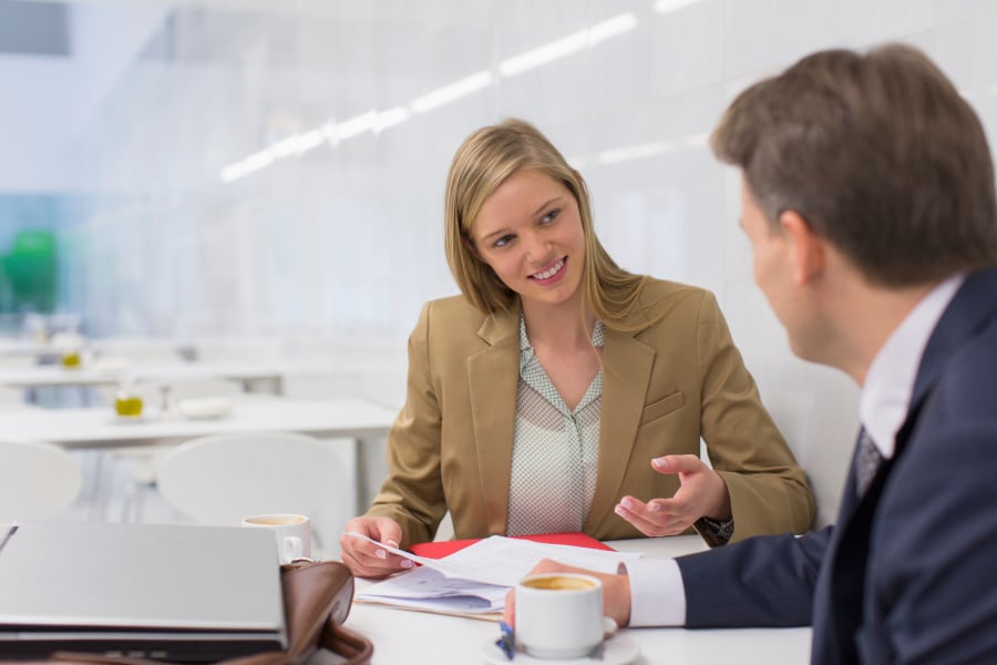 Woman giving tactful feedback to a man with empathy and candour